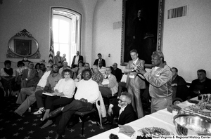 ["A man asks a question during the discussion portion of a black lung disease event with Senator John D. (Jay) Rockefeller."]%