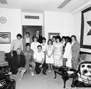 ["Senator John D. (Jay) Rockefeller stands for a photograph with a group of students from Martinsburg High School in his Washington, D.C. office."]%