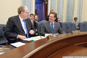 ["Senators John D. (Jay) Rockefeller and Jim DeMint laugh together before a Commerce Committee hearing."]%