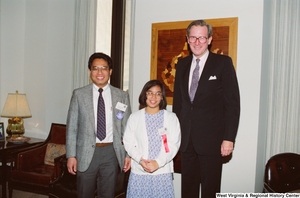 ["Senator John D. (Jay) Rockefeller stands beside a man and his daughter from Wheeling, West Virginia."]%