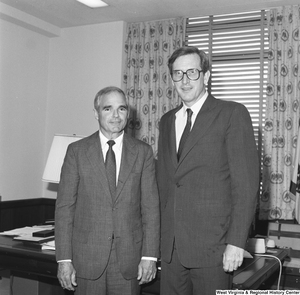 ["Senator John D. (Jay) Rockefeller stands next to a representative of Peabody Coal."]%