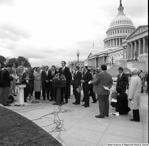 ["Senator John D. (Jay) Rockefeller speaks at an alternative motor fuels event outside the Senate."]%