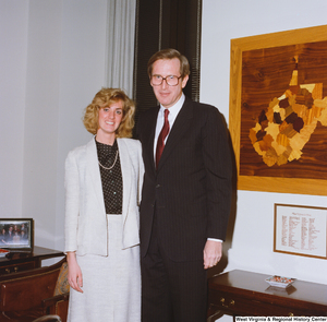 ["Senator John D. (Jay) Rockefeller stands with an unidentified young woman in his office."]%