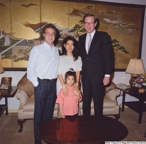 ["Senator John D. (Jay) Rockefeller stands with a young family in his office."]%