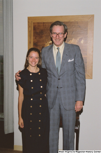 ["Senator John D. (Jay) Rockefeller stands beside a student intern."]%