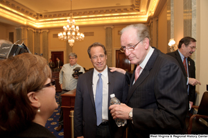 ["Senator John D. (Jay) Rockefeller holds Mike Rowe's shoulder after a Commerce Committee hearing."]%