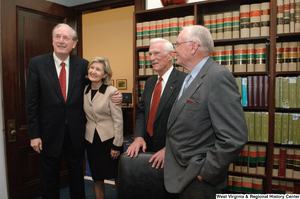 ["Senator John D. (Jay) Rockefeller and Senator Kay Hutchison hug outside the Commerce Committee hearing room."]%