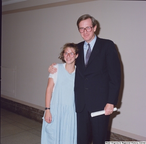 ["Color photograph showing Senator John D. (Jay) Rockefeller with an unidentified female student in the hallway of one of the Senate buildings."]%