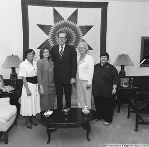 ["An unidentified group poses for a photograph with Senator John D. (Jay) Rockefeller in his Washington office."]%