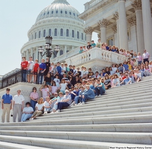 ["Students sit on the steps of the Senate."]%