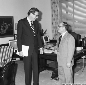 ["Senator John D. (Jay) Rockefeller speaks with an engineering professor from West Virginia University in his office."]%