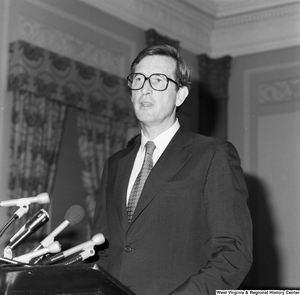 ["This image is a close-up of Senator John D. (Jay) Rockefeller speaking from behind a podium at an event in one of the Senate buildings."]%
