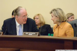 ["Senators Kay Hutchison and John D. (Jay) Rockefeller talk during a Commerce Committee hearing."]%