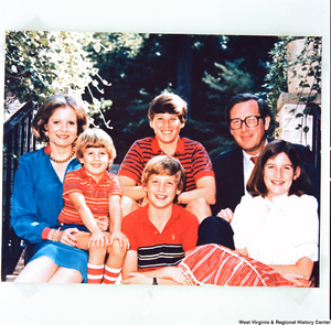 ["This is a photograph of the photo that the Rockefeller family used in their 1984 Holiday Card. Senator John D. (Jay) Rockefeller is joined by his wife Sharon and their children Jamie, Valerie, Charles, and Justin."]%