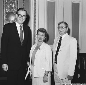 ["Senator John D. (Jay) Rockefeller stands for a photograph with two members of the Goodtime Mountain Singers."]%