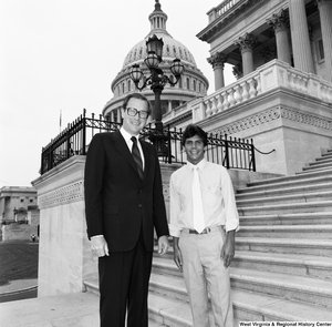 ["Senator John D. (Jay) Rockefeller poses for a photograph on the steps of the U.S. Capitol Building with Congressman Mollohan's intern, Eric Sherman."]%