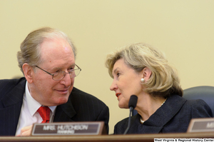 ["Senators John D. (Jay) Rockefeller and Kay Hutchison talk during a Commerce Committee hearing."]%