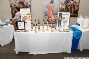 ["A table of Sweet Shine liquors from Charles Town sits at the 150th birthday celebration for West Virginia."]%