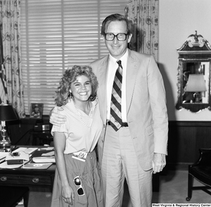 ["Senator Rockefeller poses for a photograph with an unidentified participant in the Washington Workshops program. Founded in 1967, Washington Workshops is an organization that provides experience-based learning opportunities in various fields in Washington, D.C."]%