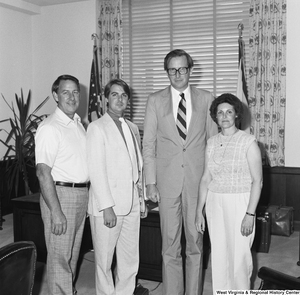 ["Three unidentified individuals stand for a photograph with Senator John D. (Jay) Rockefeller in his Washington office."]%