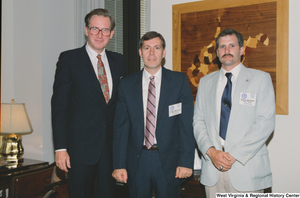 ["Senator John D. (Jay) Rockefeller stands beside two West Virginians who are participating in the Federal Forum of the Presidential Classrooms program."]%