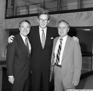 ["Photograph of Senator John D. (Jay) Rockefeller standing with two unidentified men in the Hart Building."]%