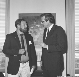 ["Senator John D. (Jay) Rockefeller speaks to a man who is participating in the Presidential Classroom for Young Americans."]%