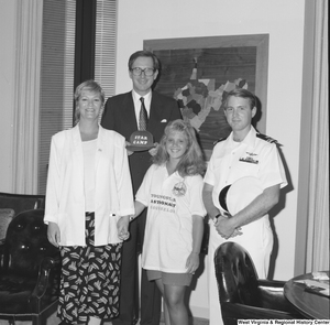 ["Senator John D. (Jay) Rockefeller stands with a Youngstar Astronaut Counselor and her parents in his office."]%