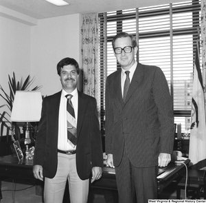 ["Senator John D. (Jay) Rockefeller stands in his office for a photograph with an unidentified individual."]%