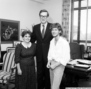 ["Senator John D. (Jay) Rockefeller stands with two unidentified guests in his Washington office."]%