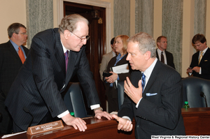 ["Senator John D. (Jay) Rockefeller talks with an unidentified man after a Commerce Committee hearing."]%