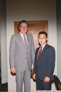 ["Senator John D. (Jay) Rockefeller stands next to an unidentified man in his office."]%