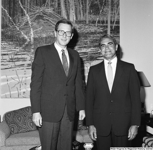 ["Senator John D. (Jay) Rockefeller stands in his office next to a representative of the National Coal Association."]%