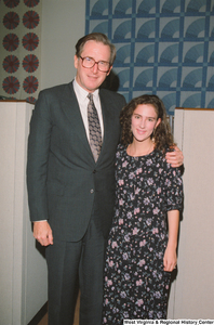 ["Senator John D. (Jay) Rockefeller stands with an unidentified woman in his office."]%