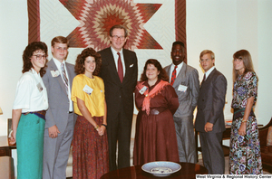 ["Senator John D. (Jay) Rockefeller stands with seven participants in the National Young Leaders Conference in his office."]%