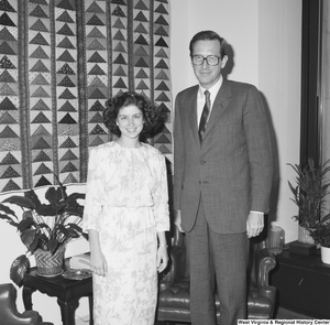 ["Senator John D. (Jay) Rockefeller stands next to an unidentified woman in his office."]%