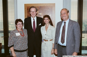 ["Senator John D. (Jay) Rockefeller stands with representatives of the West Virginia Education Association."]%