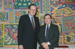 ["Senator John D. (Jay) Rockefeller stands next to a representative from Geneva Steel in his office."]%