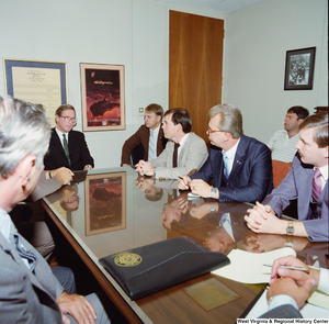 ["Senator John D. (Jay) Rockefeller sits at the head of the conference table in his office and listens to representatives of the Fraternal Order of Police, West Virginia State Lodge. They discussed tax provisions to protect the pensions of public safety employees, like police officers and firefighters."]%