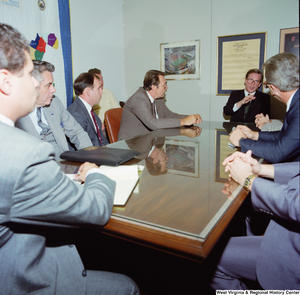 ["Senator John D. (Jay) Rockefeller sits with a group of individuals from the West Virginia State Lodge of the Fraternal Order of Police around the conference table in his office. They discussed the tax status of pension plans for municipal public safety employees, including firefighters and police officers, and Senator Rockefeller worked to add an amendment to a tax bill to protect these kinds of workers."]%