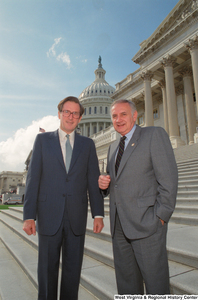 ["Senator John D. (Jay) Rockefeller stands next to a man on the Senate steps."]%