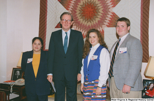 ["Senator John D. (Jay) Rockefeller stands with three West Virginia students who are participating in the National Young Leaders Conference."]%
