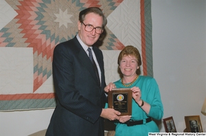 ["Senator John D. (Jay) Rockefeller receives a special award from the Vietnam Veterans of America."]%