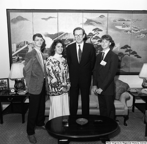["Senator John D. (Jay) Rockefeller stands in his office with three participants in the National Young Leaders Conference."]%