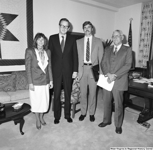 ["Senator John D. (Jay) Rockefeller stands for a photograph with three unidentified guests in his Washington office."]%
