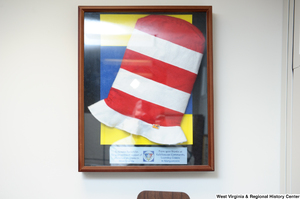 ["A \"Cat in the Hat\" hat display hangs on the wall in Senator John D. (Jay) Rockefeller's office. The display reads \"To Senator Rockefeller, for your continued support of afterschool programs in West Virginia. From your friends at Kaleidoscope Community Learning Centers in Morgantown.\""]%