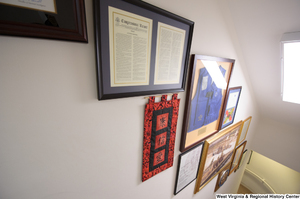 ["This photo shows items hanging in the stairwell of Senator Rockefeller's office."]%