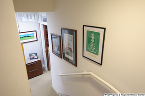 ["Three photos hang on the wall at the bottom of the stairs in Senator John D. (Jay) Rockefeller's office."]%
