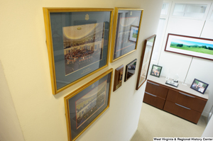 ["Several framed items hand on the wall at the bottom of the stairwell in Senator John D. (Jay) Rockefeller's office."]%