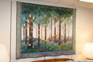 ["A colorful forest quilt hangs in Senator John D. (Jay) Rockefeller's office."]%